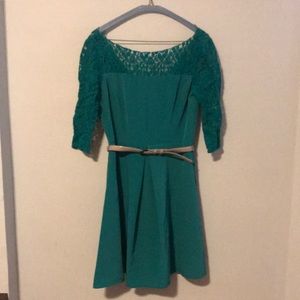 green dress with lace sleeves and neckline